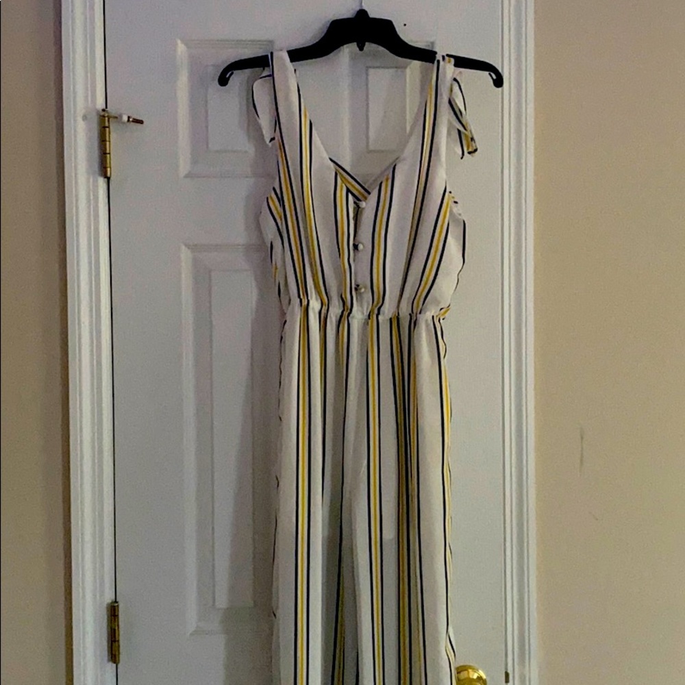 White jumpsuit with yellow and navy blue stripes